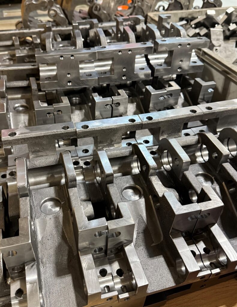Precision machined metal bracket components